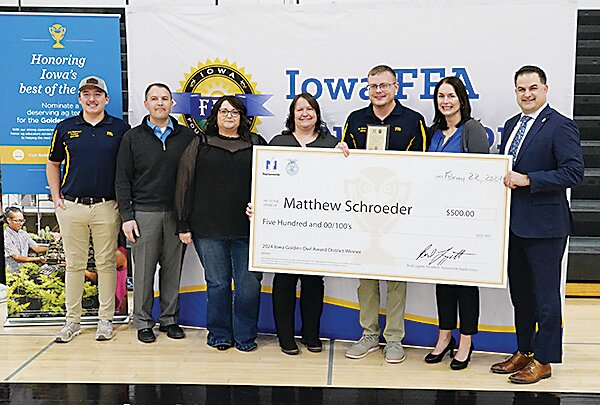 Estherville FFA Instructor Matthew Schroeder was named a finalist for the 2024 Golden Owl Award at the beginning of the FFA rally at Estherville Lincoln Central High School last week. From left are Estherville FFA Chapter President River Rasmussen, Kevin Schock, Shanna Carlin and Nicole Tifft of Cornerstone Insurance Services, Matthew Schroeder, Ann Gillotti, from the Iowa FFA, and Matthew Eddy from the Iowa Department of Education.