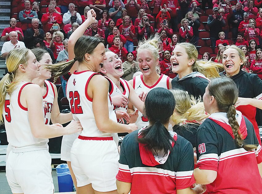 The Estherville Lincoln Central Girls Basketball Team celebrates its Class 3A state quarterfinal victory over Forest City on Monday at Wells Fargo Arena in Des Moines. The Midgets play at 1:30 p.m., today against Mount Vernon. For more details, turn to Page 1B of today&rsquo;s Estherville News.