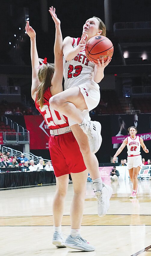 ELC junior Haylee Stokes (23) drives in from the left side for two of her game-high 44 points on Monday in a Class 3A State Quarterfinal game against Forest City.