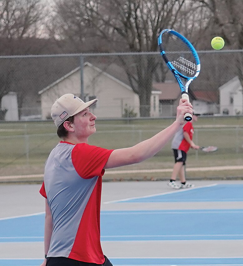ELC’s No. 2 singles player Leo Fortin hits a return during play Monday in Estherville.