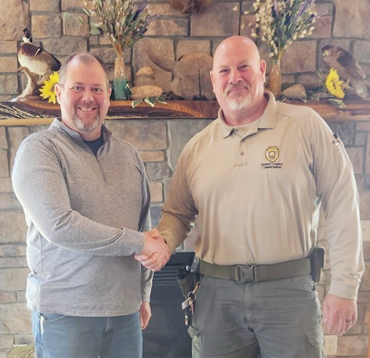Eric Anderson, right, welcomed Matt Reineke as the new Emmet County Conservation Board director at the board&rsquo;s April 4 meeting.