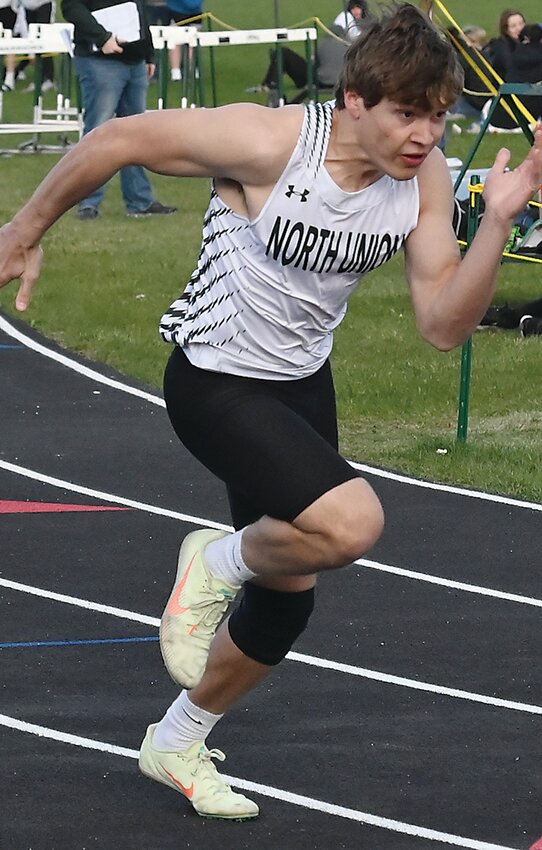 North Union’s Preston Guerdet takes off in the 400-meter dash during the 2024 John Larson Relays in Armstrong last Thursday.