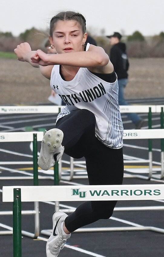 North Union’s Cloey Anderson leaps a hurdle during the 100-meter hurdle race last Thursday in Armstrong
