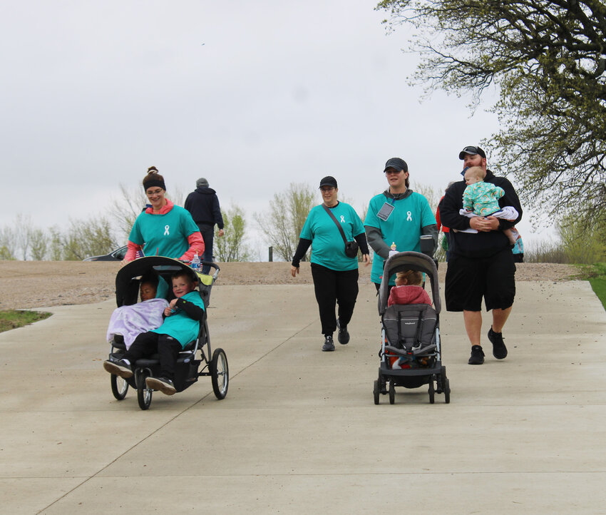 Walkers and runners completed the 2.22 mile track around the Dickinson County Nature Center Saturday morning to raise awareness of veteran PTSD and do something about it: raise money for Partners for Patriots to train and provide service dogs to veterans with PTSD.