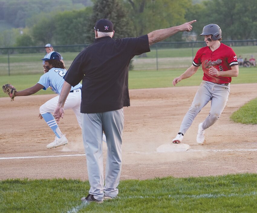 ELC first baseman Kendall Molacek had plenty of time to pick up the ball and record the out on this play during Monday’s game.