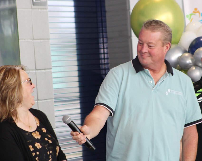 Amy Adams and Jason Bendixen share a laugh at the Lead the Ville graduation.