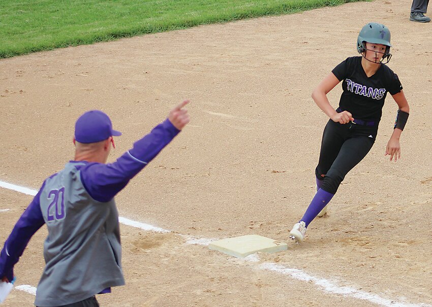 Graettinger-Terril/Ruthven-Ayrshire coach Kyle Norris sends Myah Wise home for another Titan run during Monday&rsquo;s 13-8 loss to Pocahontas Area. Look for the recap up that game in next week&rsquo;s edition of the Estherville News.