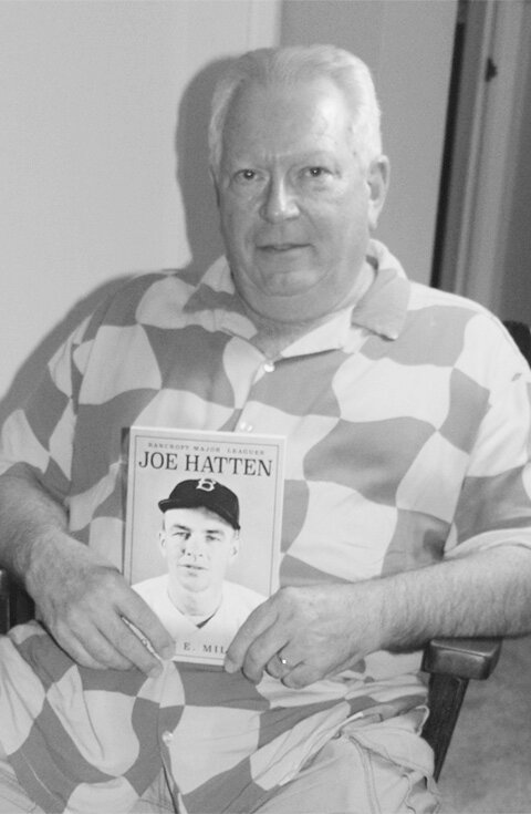 Author Gene Miller with his book on Joe Hatten.