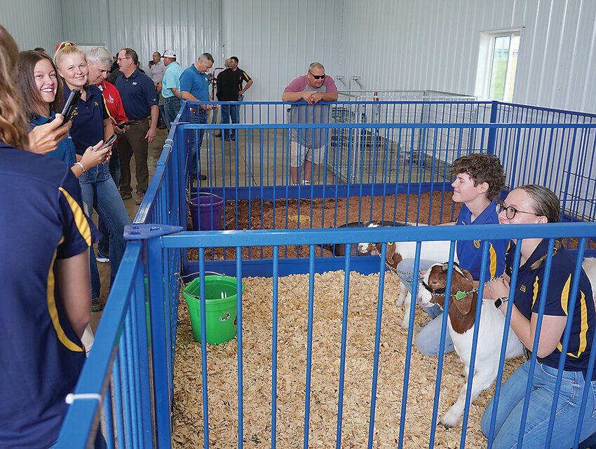 Students pose with their goats during the open house of the Robert Griffith Agricultural Learning Center held Saturday at the newly-finished facility.