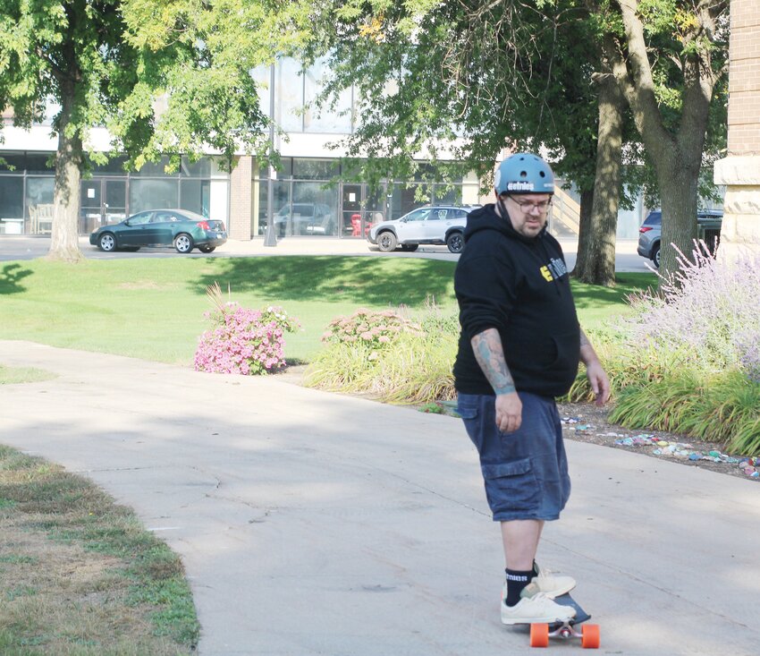 Jeremy Pfaff prepares for a journey around Iowa to raise awareness of hydrocephalus by skateboarding longer and longer distances.