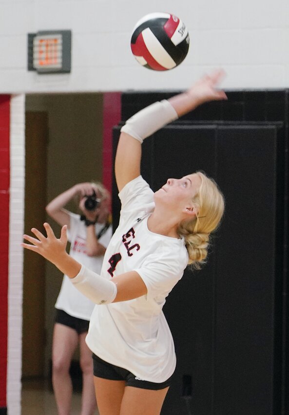 ELC’s Mara White sends up a serve during a home match earlier this month.