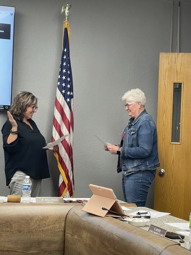 Current city clerk Beth Burton reads the oath of office to Sara Bendixen, who will be Estherville’s city clerk as of March 28, 2025. Burton is retiring on that date.