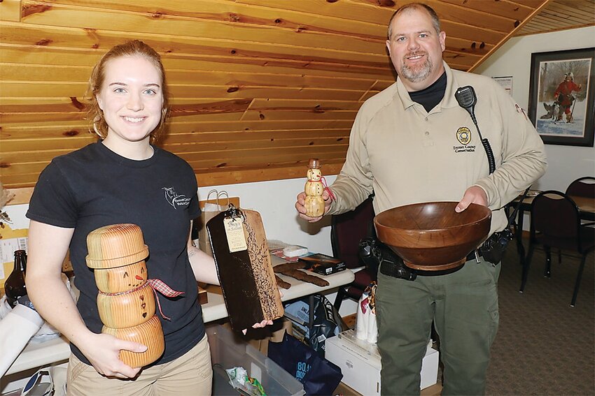 Emmet County Conservation Board Naturalist Sidney Krueger and Conservation Board Director Matt Reineke with some of the prizes available at the annual Emmet County Nature Center banquet. The banquet will be held Saturday, March 15 at the Estherville Elks Lodge with doors opening at 5:30 p.m.