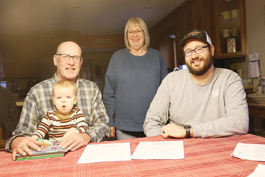 Brian Cronk with grandson Rhett, Jackie Cronk and Jim Cronk, Rhett’s father. Brian and Jackie Cronk make the fourth generation on the Cronk Heritage Farm, Jim the fifth and Rhett the sixth.