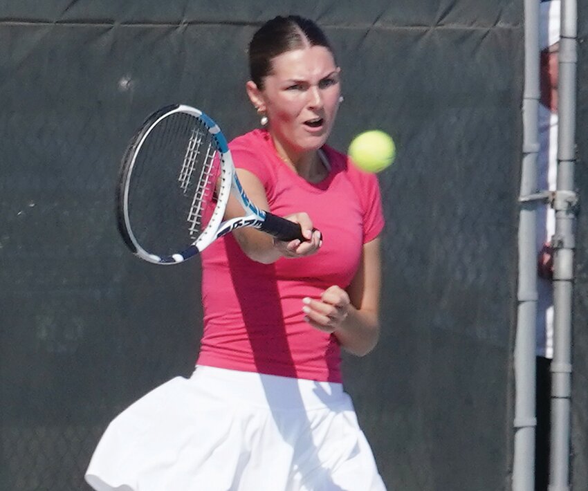 ELC senior Hope Pytleski hits a return during Monday’s match against Spirit Lake-Okoboji.