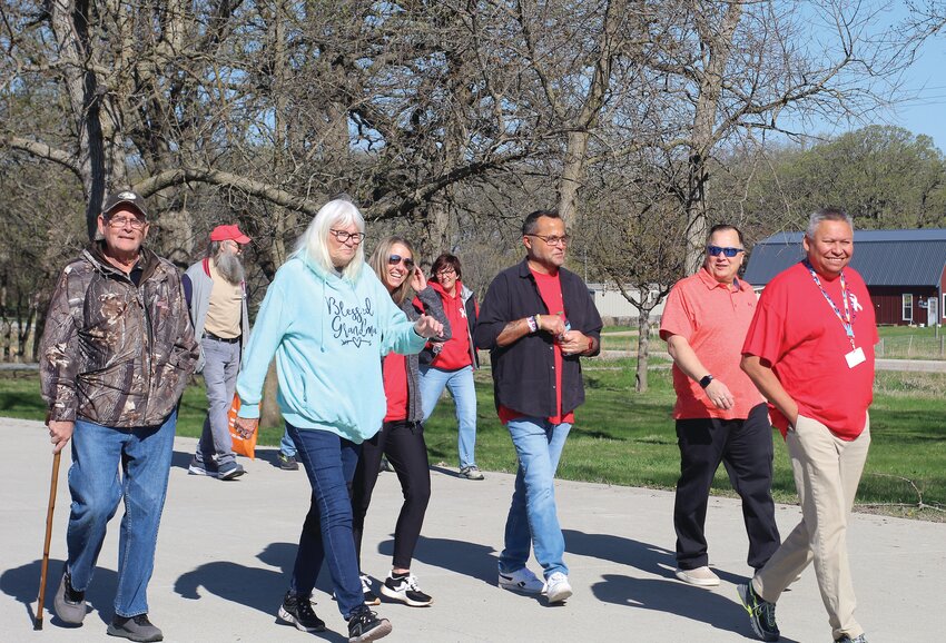 Veterans and their supporters gathered Saturday morning to walk around the Dickinson County Nature Center trails to raise money for homeless veterans.