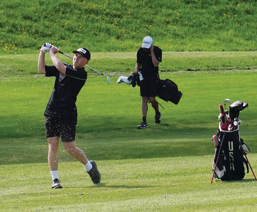 ELC’s Thomas Beaver drives toward the green during last week’s win over Emmetsburg.