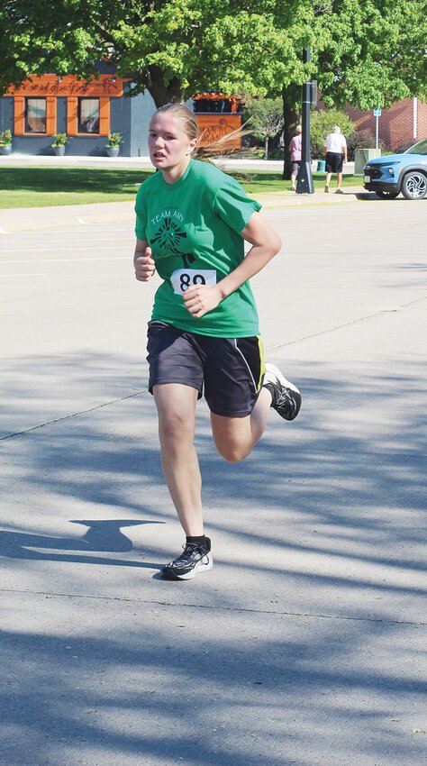 Helen Lavender, an active high school runner, put her effort into the 5k.