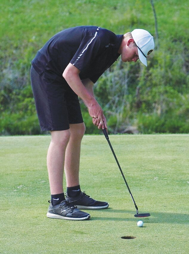 Brady Ingvall hits a putt on Hole No. 9 in ELC&rsquo;s final home meet against Emmetsburg earlier this month.
