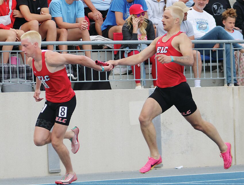 ELC&rsquo;s Kale Shatto hands off to Garrett Smith in the 4x400-relay preliminaries last Friday.
