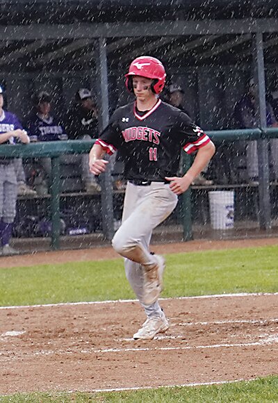 ELC senior Tate White scored the first run against Spencer last Thursday.