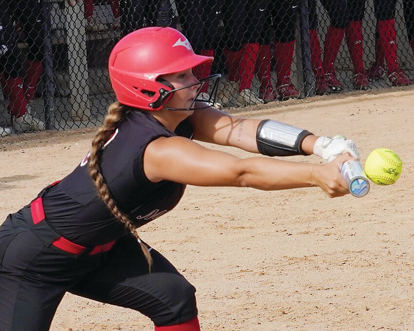 ELC’s Suri Shatto makes contact for a sacrifice bunt in the fourth inning against Storm Lake on Monday. The two teams play again today in Storm Lake.