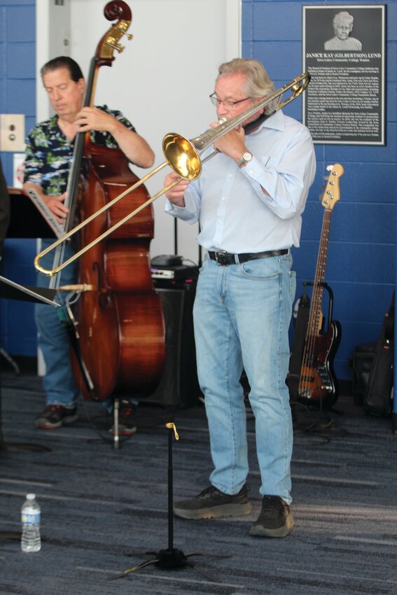 Trombonist Dan Cassady has performed with numerous bands and is sales associate and brass instructor at West Music in Coralville, and adjunct professor of music at Kirkwood Community College in Cedar Rapids. Previously he taught music and directed band programs at Fort Dodge Senior High School, Iowa Central Community College, and St. Edmond High School. Dan also works as a clinician with school band programs throughout Iowa. Bassist Andy Hall plays both electric and acoustic bass, as he is playing here. Andy has recorded and performed with many different artists and considers the challenge of jazz his favorite genre.