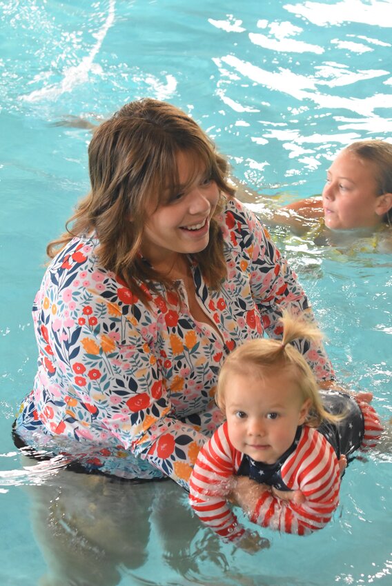 One of the lessons Burch offers is a Parent-Tot class. This class is aimed at small children and focused on getting them comfortable with the water. Burch also helps to teach basic skills that the children will need as they get older and build their swimming abilities.