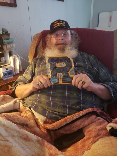 Tom Johnson, an Elroy resident, poses with his Royall High School letter. After more than fifty years, Johnson received the letter he was denied back in high school.