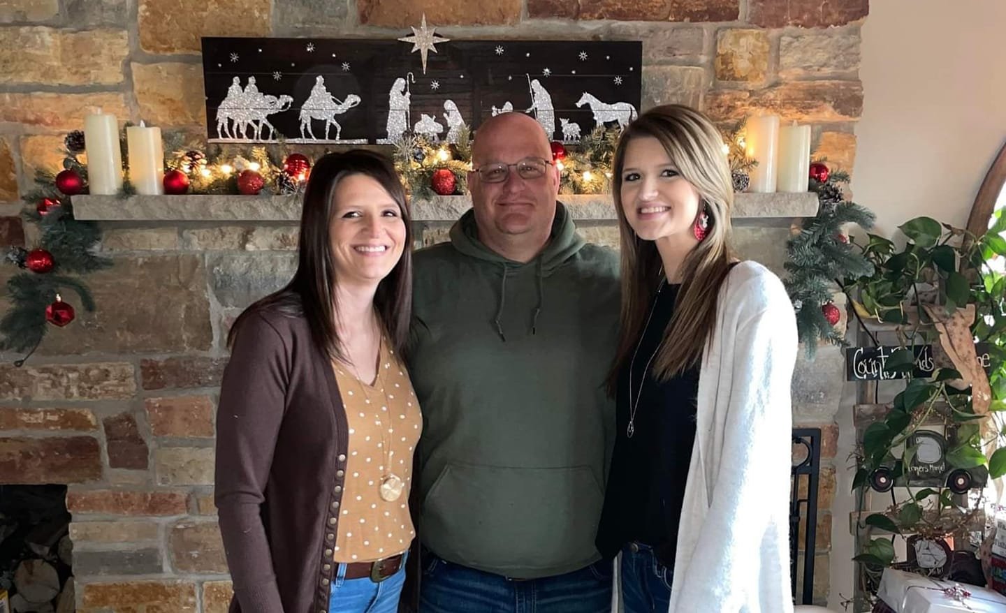 Sandy Barnhart (left) poses with her husband Izaak (center) and daughter Danielle (right). Barnhart and her family discovered an interest in goats after relocating to their new home outside of Elroy in 2018, which then led to her and her daughter developing a thriving business based on goat milk soap.