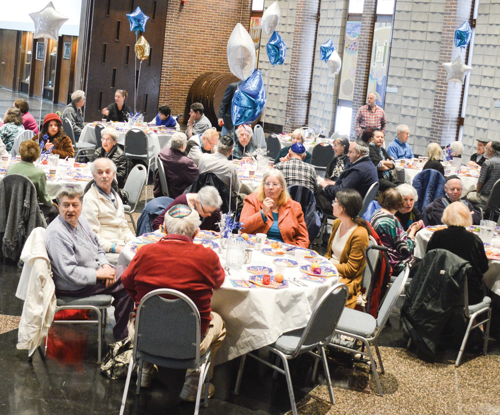 Seniors from the Kosher meal sites enjoy a Hanukkah party  in December 2015 at Temple Emanu-El. On April 8, there will be a community seder at Temple Sinai.