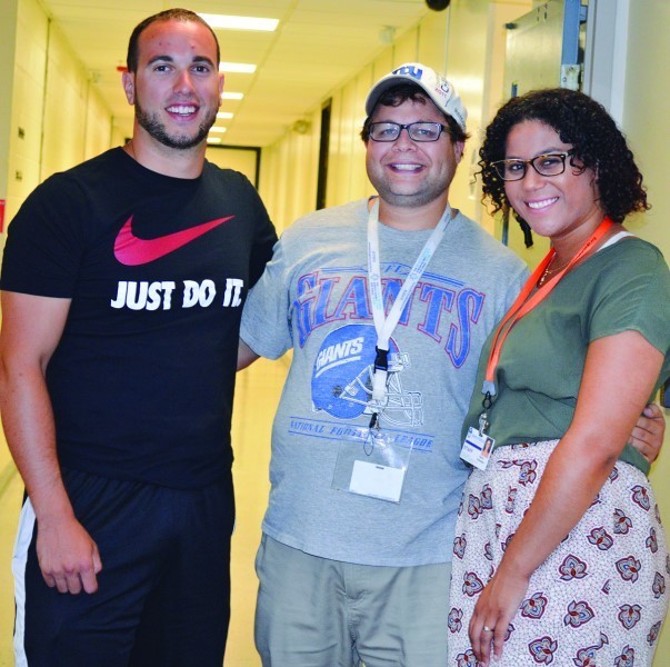 Campers catch director Seth Finkle   with Rob and Lexi in the hall.