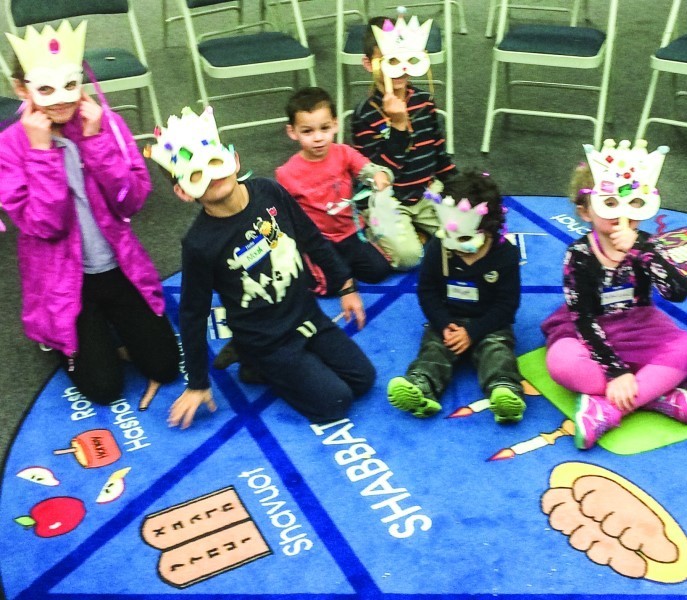 Children participate in a Purim activity last year at Temple  Sinai.