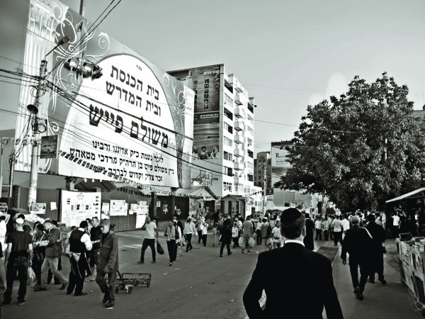 In Uman, Hebrew letters cover store fronts and the sides of buildings so that from a photograph it looks more like Bnei Brak than Eastern Europe.