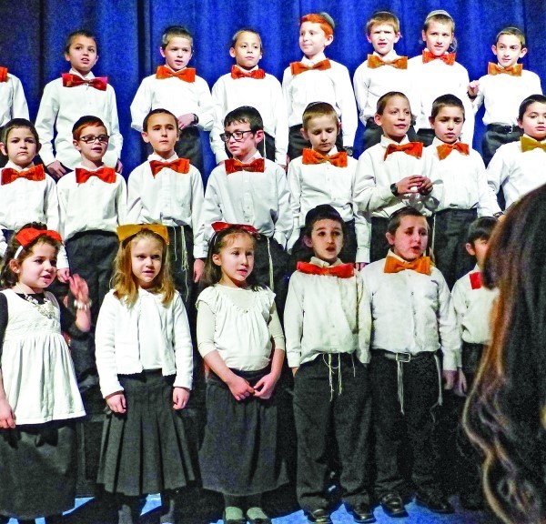 Student in grades 1-3 perform in the choir at the pre-Hanukkah celebration on Dec. 21.   The choir was under the direction of Rabbi Avrohom Jakubowicz and Mrs. Shiffy Yukdowsky.