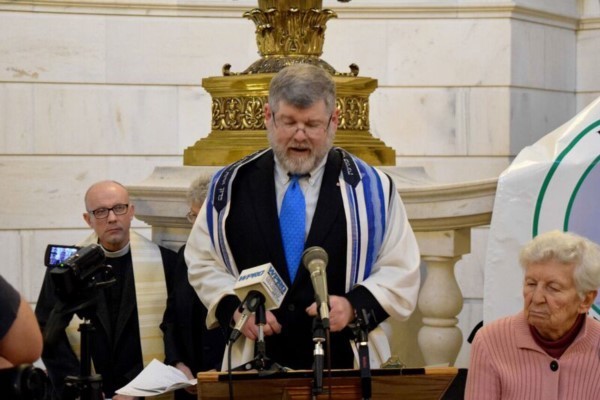 Rabbi Jeffrey Goldwasser speaks at the annual Fighting Poverty with Faith vigil held in the Rhode Island State House rotunda