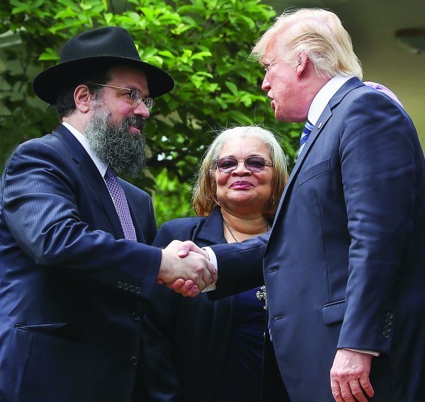 President Donald Trump greeting clergy members, including Rabbi Marvin Hier, right, in the Rose Garden   at the White House, May 4.