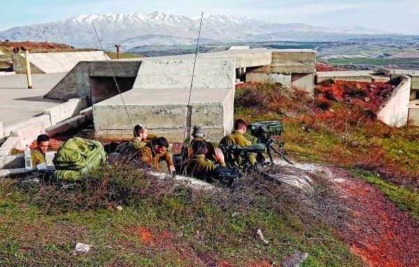 Israeli soldiers taking positions near the border with Syria, Feb. 10.