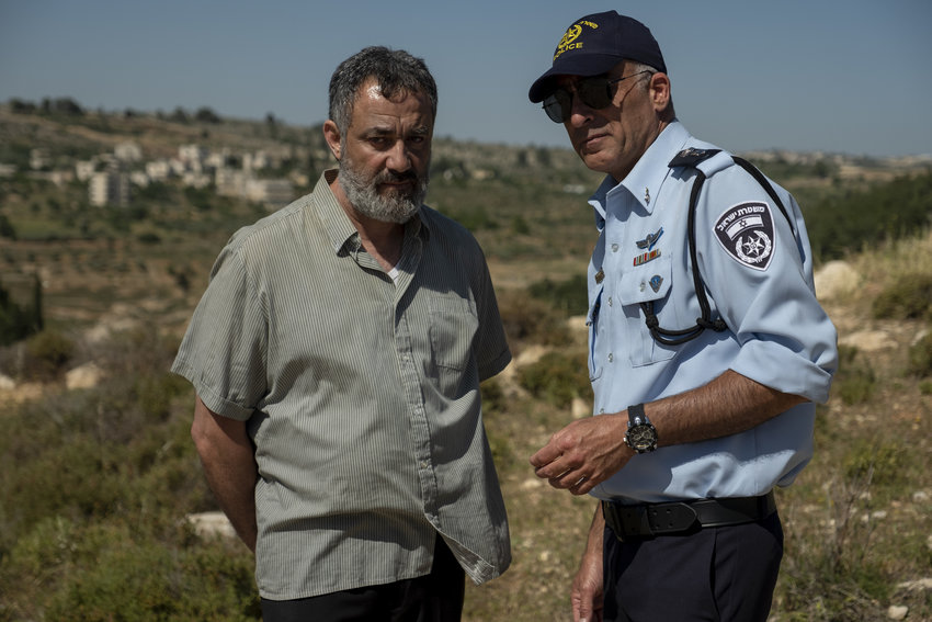 Johnny Arbid, left, plays the grieving father of a slain Palestinian teen in &quot;Our Boys.&quot;