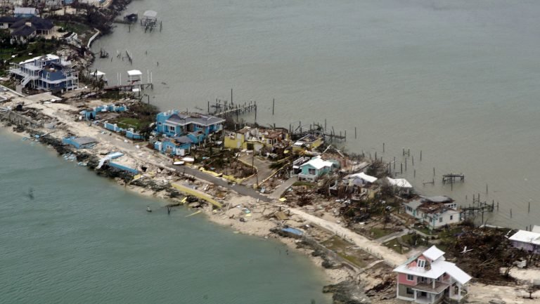 Overhead view of a row of damaged structures in the Bahamas.