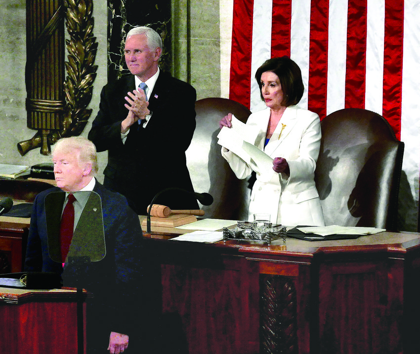 President Donald Trump at the end of his State of the Union address with Vice President Mike Pence and House Speaker Nancy Pelosi.