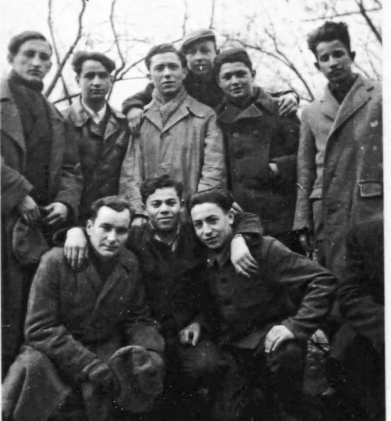 Michael Kutz (front, right) with fellow Lodz partisans, above. Left, handwritten copy of Bergen Belsen rabbi's dispensation.