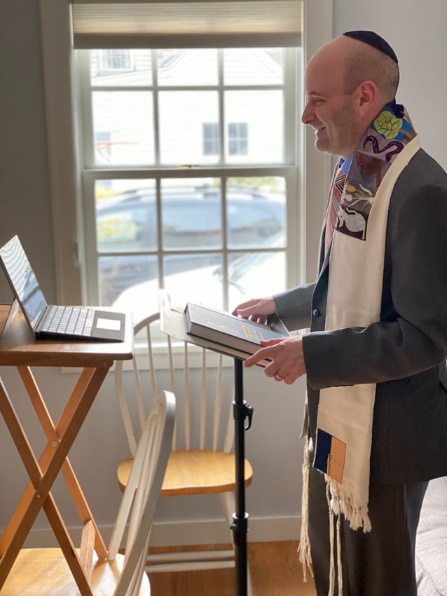 Rabbi Danny Burkeman has seen a big turnout at virtual services, which he leads from home.