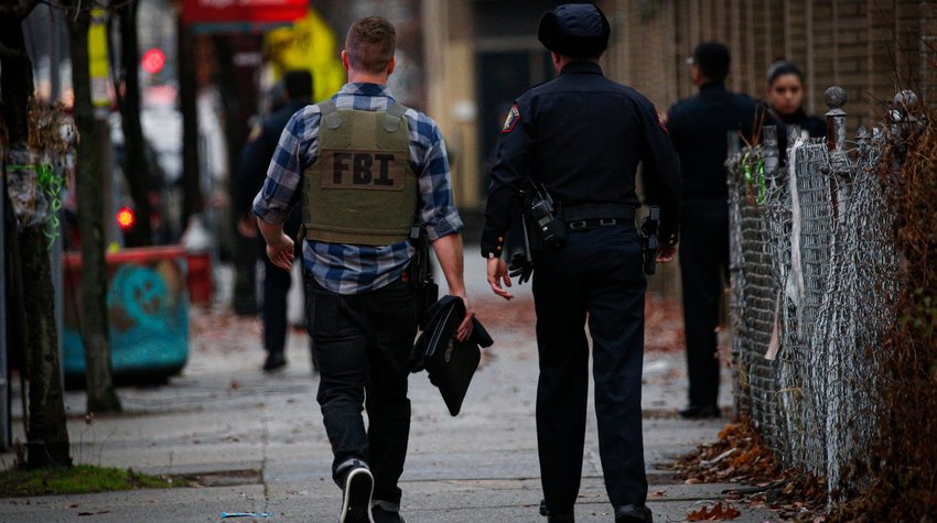 A FBI officer arrives at the scene of an active shooting in Jersey City, N.J., Dec. 10, 2019.