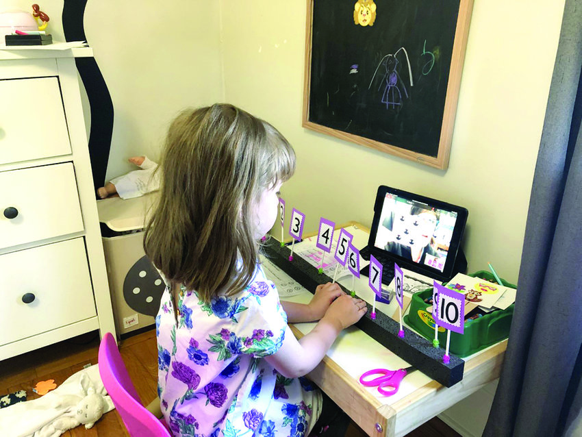 A student learning at home in the spring