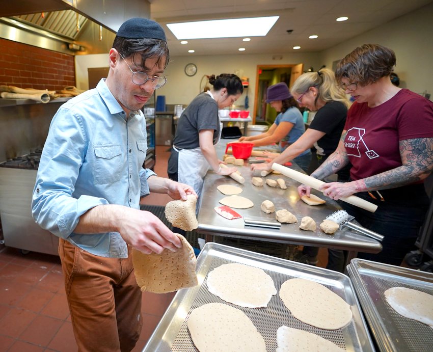 Rabbi Barry Dolinger helps bake matzah in March 2020.