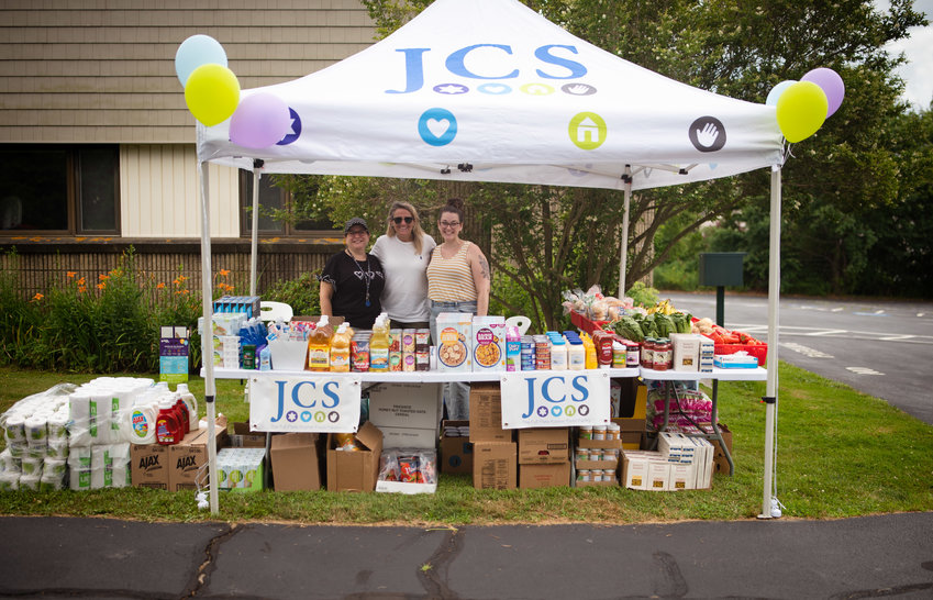 The Kosher food pantry display at Temple Shalom in Middletown. Staff members are (left to right) Marcie Ingber, Janelle Roussel and Carol Wild.
