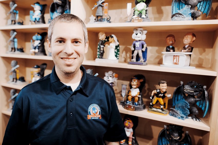 Phil Sklar and his bobbleheads.