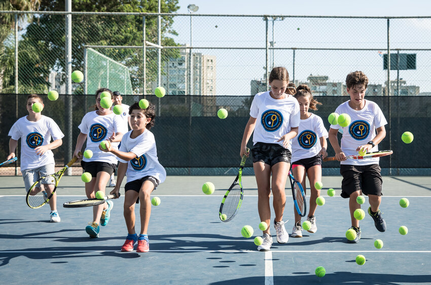 Players from Israel Tennis and Education Centers practice in Israel. A group will be in Newport next week.