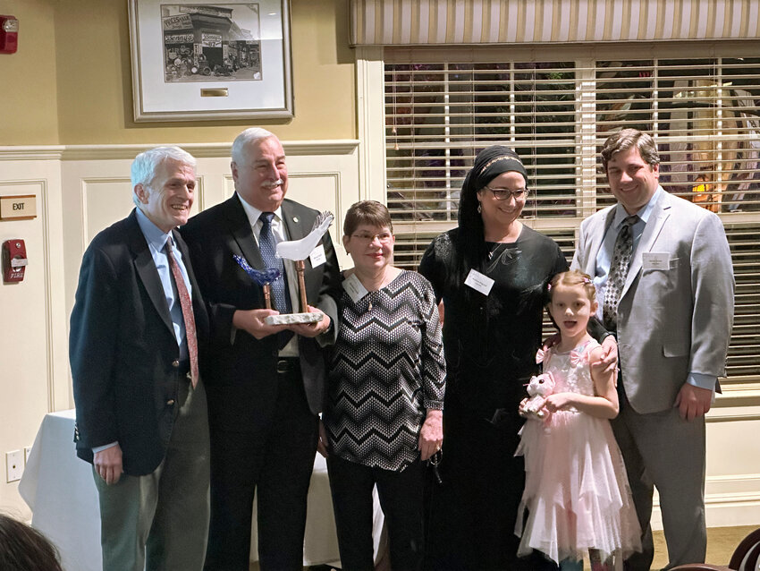 ABOVE From left, Scott Wolf presents the Jewish Collaborative Services Ruth and W. Irving Wolf Jr. Award for Generational Philanthropy to Michael Smith and his wife Marilyn, Dr. Andrea Allgood, Ariana Smith and Adam Smith.